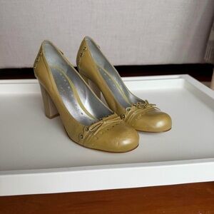 BCBGirls Olive Green Block Heel Pumps with Bow and Stud Accents